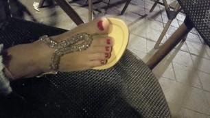 gf shows her sexy pediucred feet toes in new sandals at cafe